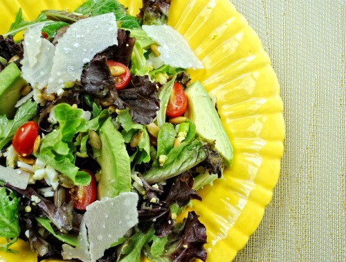 Baby greens with eggs, avocado, and shaved Parmesan