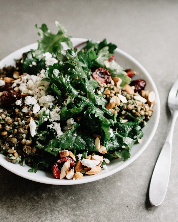 Baby kale salad with cherries, marinated lentils + goat cheese
