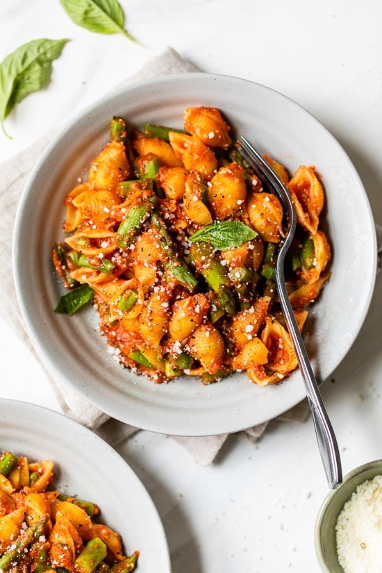Baby pasta shells with asparagus and marinara sauce
