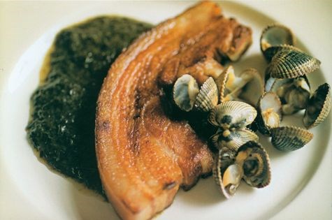 Bacon chop with laver bread and cockles