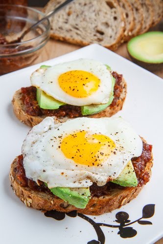 Bacon jam breakfast sandwich with fried egg and avocado
