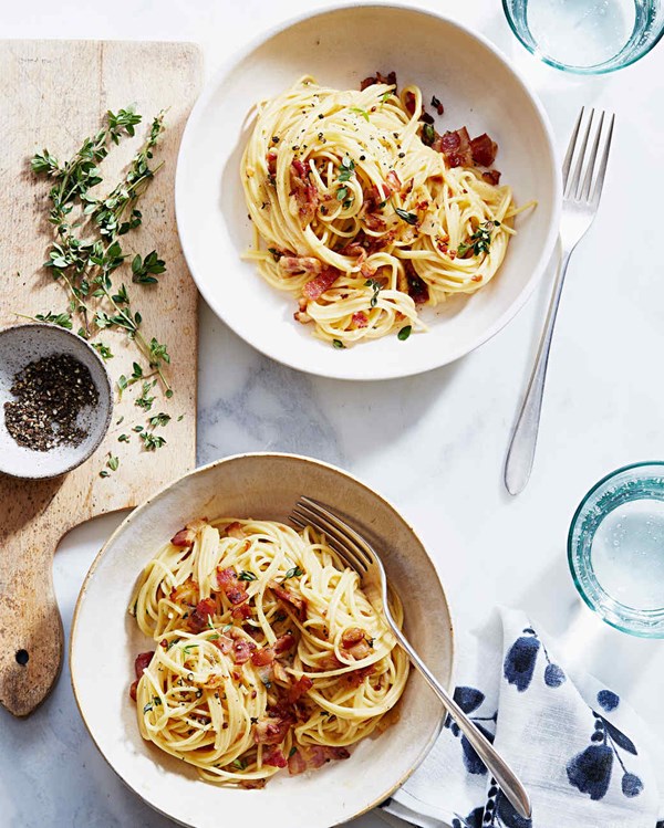 Bacon pasta with cheese sauce and thyme