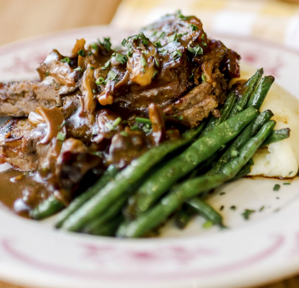 Bacon-wrapped meatloaf with mushroom gravy