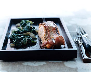 Bacon-wrapped salmon with wilted spinach