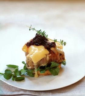 Bacon-wrapped turkey burger with melted Camembert, and spicy cranberry-green peppercorn relish