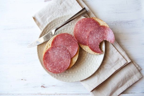 Bagel with butter and salami