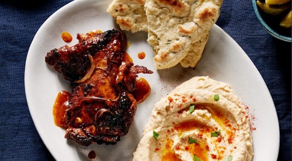Baharat chicken thighs with hummus and flatbread [Brad Mahlof]