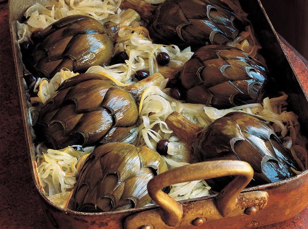 Baked artichokes with onions, lemons, black olives, and mint
