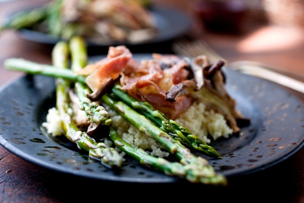 Baked asparagus with shiitake, prosciutto and couscous