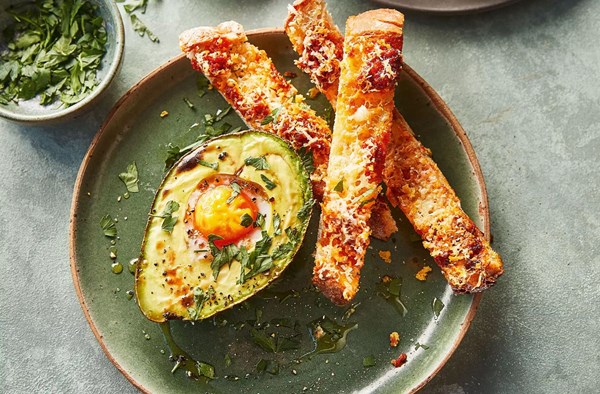 Baked avocado eggs with cheesy 'nduja soldiers