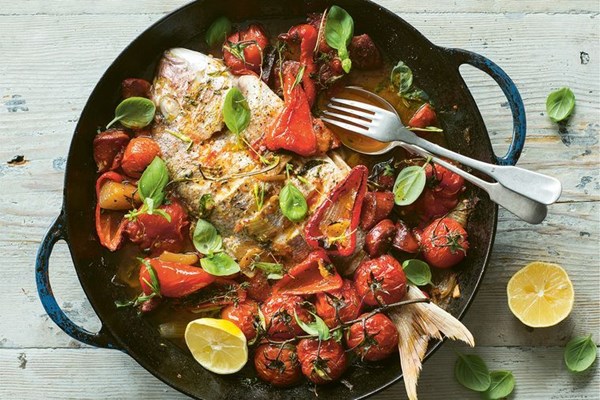 Baked baby snapper with chorizo, cherry tomatoes and capsicum