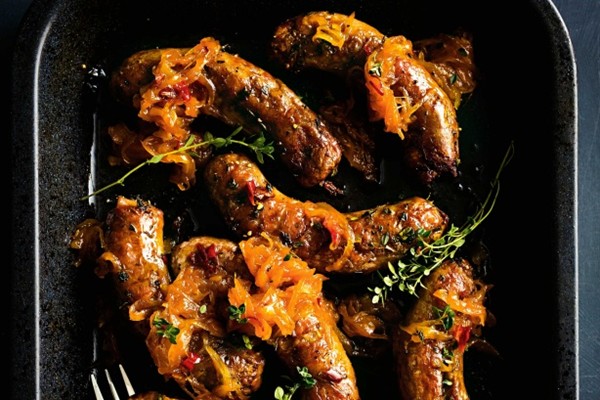 Baked bangers with caramelised Sriracha onions