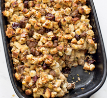 Baked bread stuffing with sausage, dried cherries, and pecans