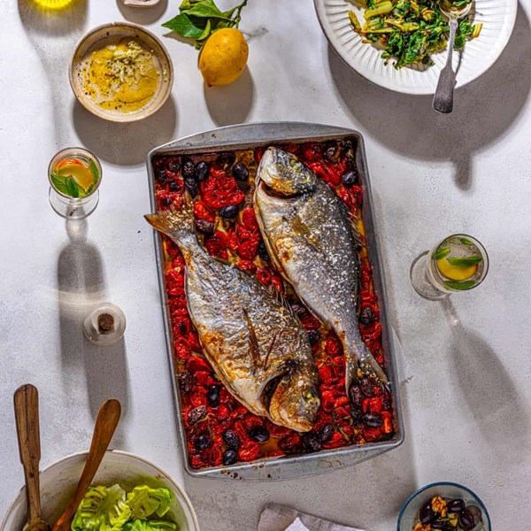 Baked bream with tomatoes, olives and rosemary