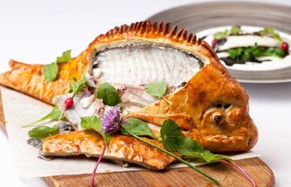 Baked bream with wilted spinach, radish and nero sauce