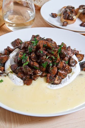 Baked Brie topped with caramelized mushrooms