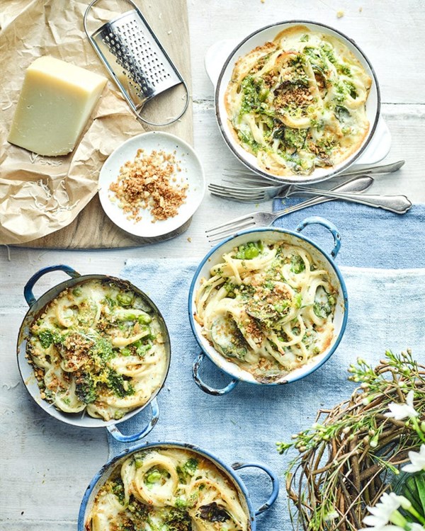 Baked bucatini pasta with peas, broad beans, fresh herbs and Grana Padano 