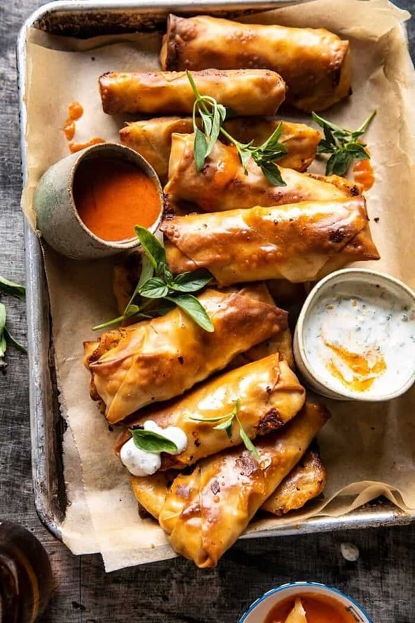 Baked Buffalo chicken egg rolls with cilantro lime ranch