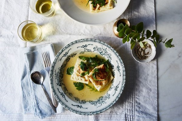 Baked burrata ravioli in Parmesan broth