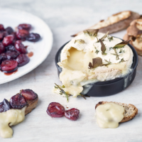 Baked Camembert with cherries and herbs