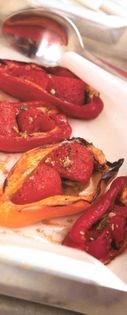 Baked capsicums stuffed with tomato, garlic and basil