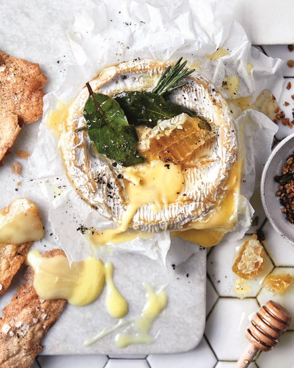Baked cheese with honey, granola and rye crackers