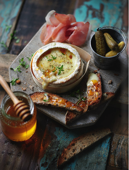 Baked cheese with honey-walnut toasts