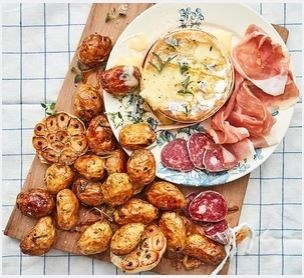 Baked cheese with roasted garlic Jersey Royals