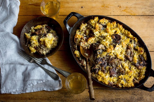 Baked cheesy pasta casserole with wild mushrooms