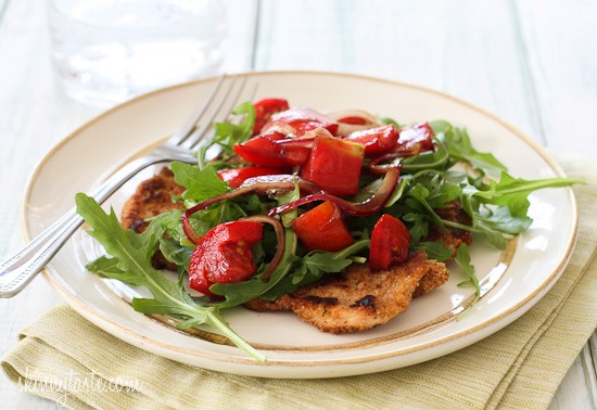Baked chicken Milanese with arugula salad and tomatoes