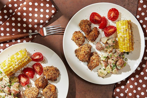 Baked chicken nuggets with warm potato salad