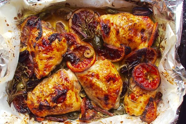 Baked chicken with blood oranges, dates, caperberries and olives