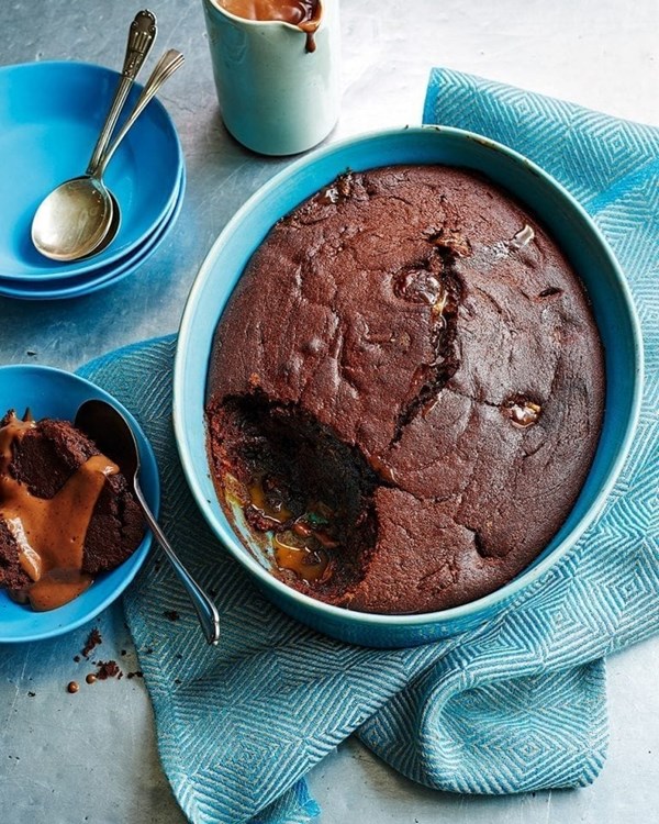 Baked chocolate and caramel sponge pudding with chocolate custard
