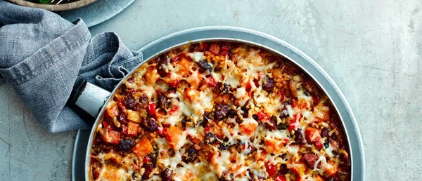 Baked chorizo and squash rice with Manchego crust