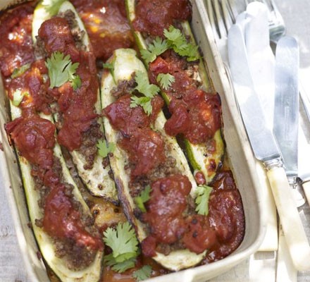 Baked courgettes stuffed with spiced lamb and tomato sauce
