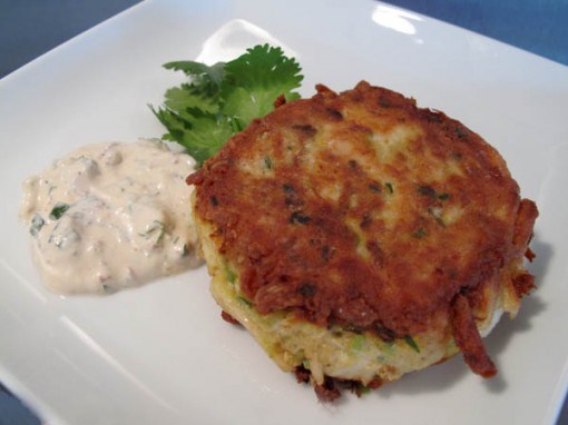 Baked crab cakes with caper-dill sauce and red pepper coulis