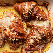 Baked croissants with ham and cheese