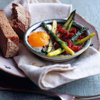 Baked duck egg with chorizo, piquillo peppers and new season's asparagus 