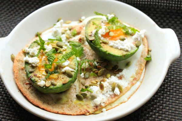Baked eggs in avocado cups with feta and mint