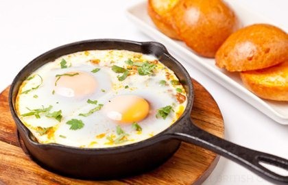 Baked eggs, minced lamb and peas