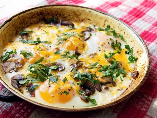 Baked eggs with mushrooms, cheddar, and ham