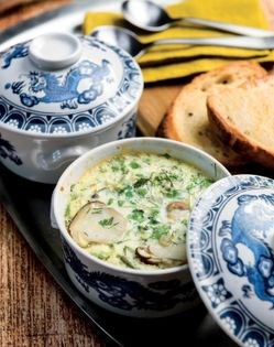 Baked eggs with porcini and peas [Annaliese Bischoff]