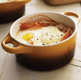 Baked eggs with prosciutto and Asiago cream