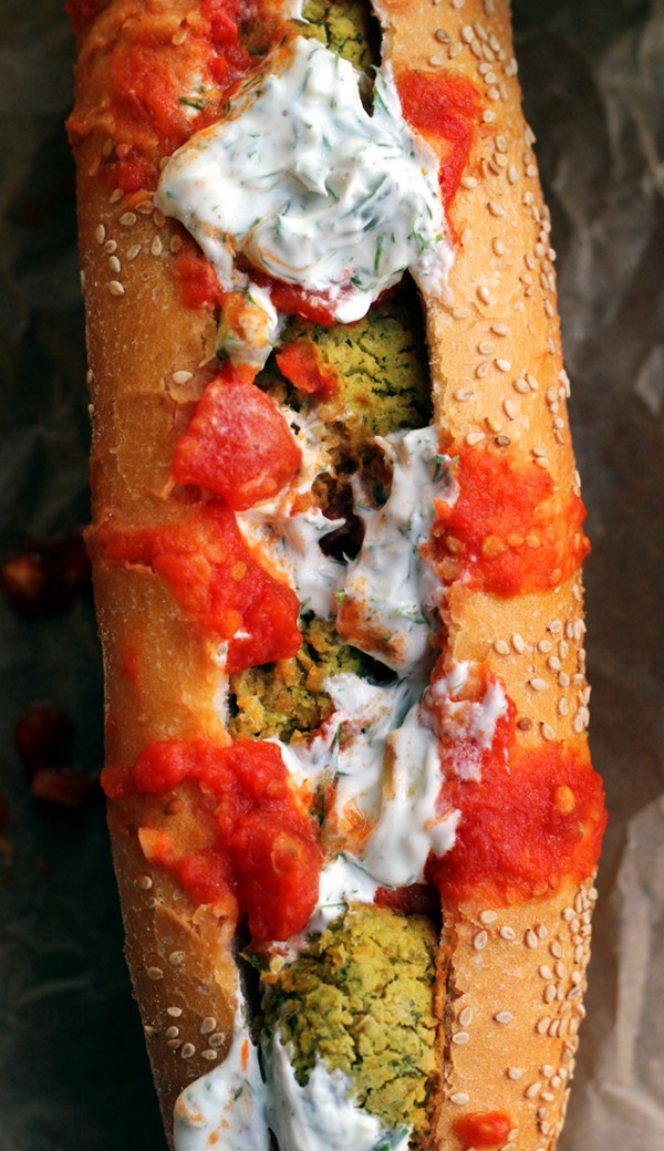Baked falafel hoagies with harissa tomato sauce and tzatziki