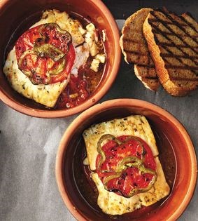 Baked feta, tomato, and pepper with olive oil and oregano (Bouyourdi)