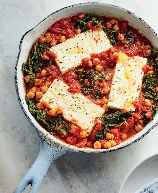 Baked feta with chickpeas and greens