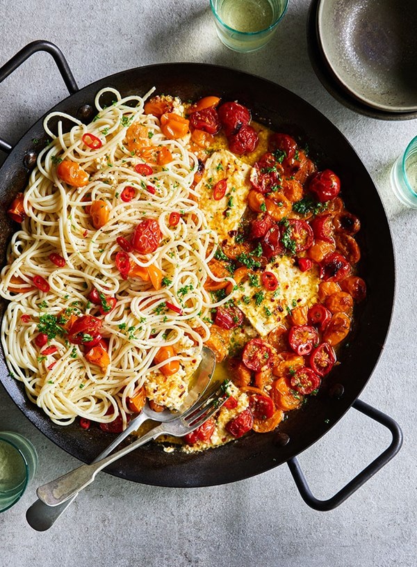 Baked feta with tomatoes and spaghetti