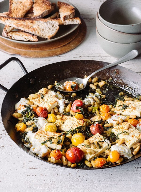 Baked feta with white beans and wilted greens