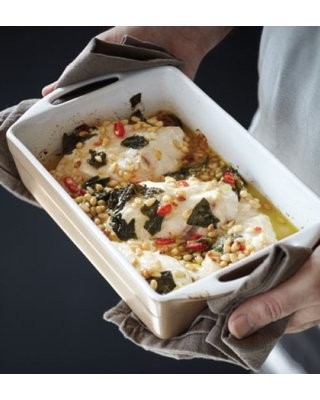 Baked fish on tomato ginger salad with pine nut sauce
