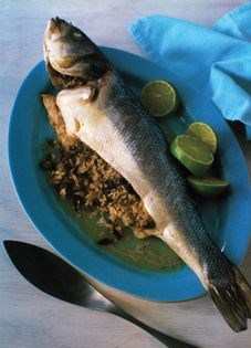 Baked fish stuffed with rice and dates